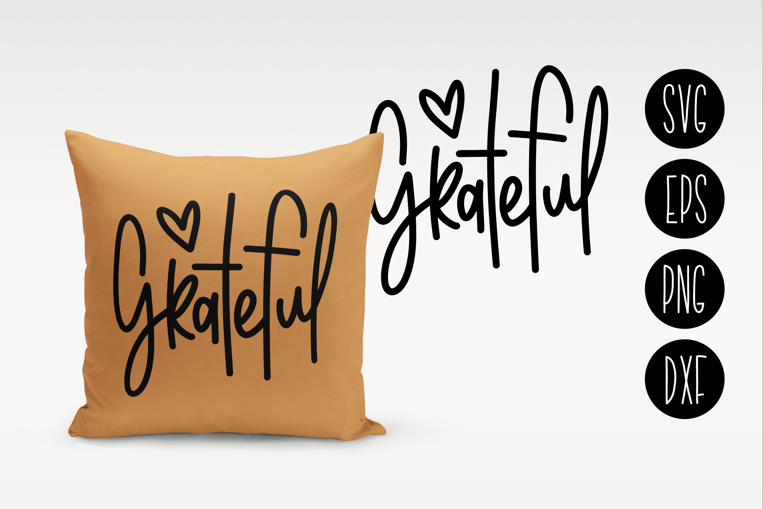 Brown pillow with 'Grateful' text on a white background